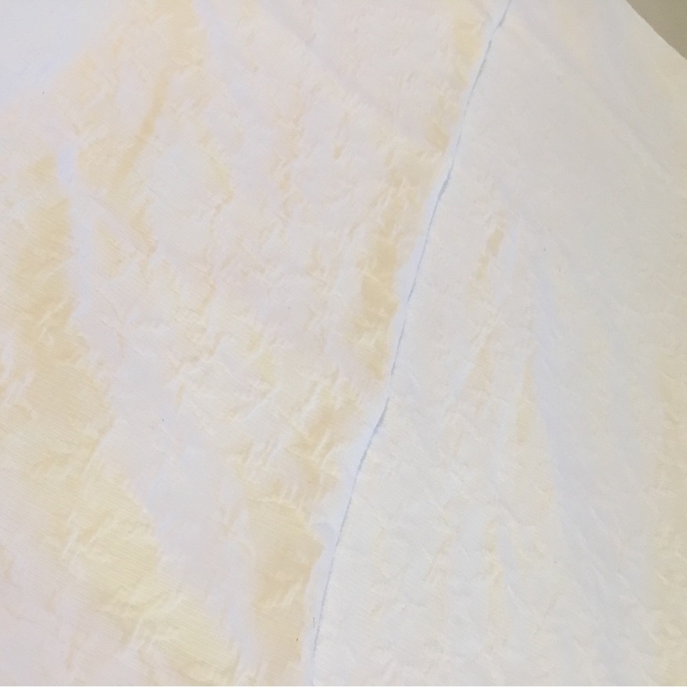 Headboard Slipcover in white matelasse fabric. Slip on. Scalding too